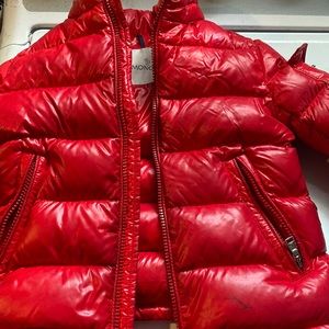 Gently used moncler boys size 5A need cleaners and it has a few marker stains